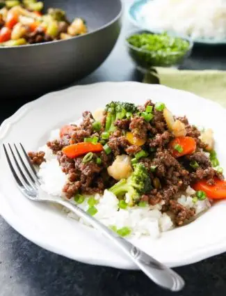 This cheap and easy Korean Beef recipe is made with ground beef instead of flank steak. It's simmered in a simple, yet flavorful sauce with added vegetables for a well-rounded meal. Serve with rice, and you've got a delicious dinner ready in 20 minutes or less!