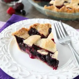 This Mixed Berry Pie uses a frozen blend of raspberries, blackberries, and blueberries which is perfect when fresh berries are out of season. No need to cook the filling ahead of time. Simply fill and bake. Enjoy this pie for the holidays or any day of the year!