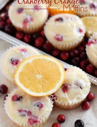 Homemade Cranberry Orange Muffins with plump, fresh cranberries, orange juice and zest, topped with an orange glaze! From DessertNowDinnerLater.com