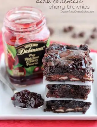 Dark Chocolate Cherry Brownies are made from a doctored box mix that has cherry filled morsels and cherry preserves swirled throughout. From DessertNowDinnerLater.com