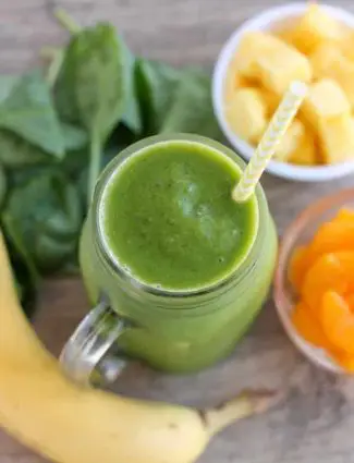 This Pineapple Orange Banana Green Smoothie is fruity and refreshing with chia seeds and spinach to add fiber and protein for additional nutrition! From DessertNowDinnerLater.com