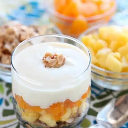 Enjoy this Dairy-Free Tropical Parfait with a homemade honey almond coconut granola base, layers of pineapple and mandarin oranges, all topped with a creamy-textured, smooth Dairy-Free Yogurt Alternative from Silk!