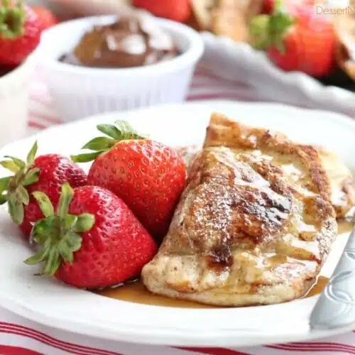 Fresh strawberries and Nutella are hidden inside this Stuffed French Toast recipe that's easy enough for the kids to help make!