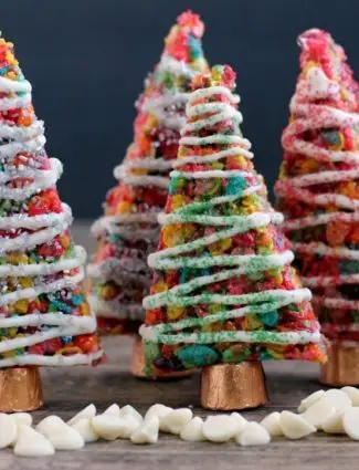 Fruity Pebbles cereal lights up these festive Krispie Treat Christmas Trees that are easy and fun to make for the holidays!