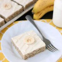 This is the BEST banana cake topped with the BEST cream cheese frosting! Perfect for picnics and potlucks, this banana sheet cake is a crowd pleaser! Everyone asks for the recipe!