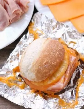 These Hot Ham and Pineapple Campfire Sandwiches are a delicious and easy tin foil recipe. Plus cleanup is a breeze! (You can even bake these in the oven too!)