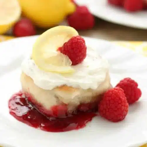 Sticky Raspberry Lemon Rolls are made easy with frozen dough and are topped with a sweet and citrusy lemon cream cheese frosting.