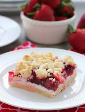 These strawberries and cream crumb bars are sweet and creamy with a buttery crumb crust and topping.