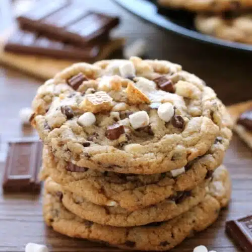 These S'mores Cookies are made with a graham cracker cookie dough, miniature chocolate chips, and marshmallows bits for a great alternative to campfire s'mores that is equally as tasty.