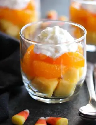 These layered fruit parfaits are a fun and festive, healthy candy corn treat for Halloween!