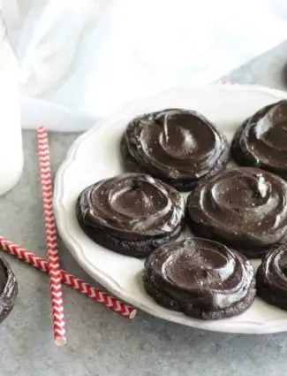 Fudgy dark chocolate sugar cookies are frosted with a creamy chocolate buttercream frosting. Inspired by Swig's Dirtball Cookie, these frosted chocolate sugar cookies are sure to be a new favorite!