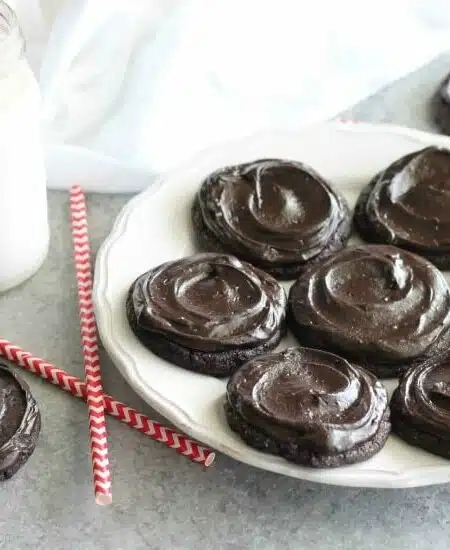 Fudgy dark chocolate sugar cookies are frosted with a creamy chocolate buttercream frosting. Inspired by Swig's Dirtball Cookie, these frosted chocolate sugar cookies are sure to be a new favorite!