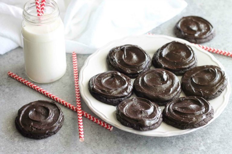 Fudgy dark chocolate sugar cookies are frosted with a creamy chocolate buttercream frosting. Inspired by Swig's Dirtball Cookie, these frosted chocolate sugar cookies are sure to be a new favorite!