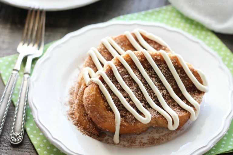 Churro French Toast - Thick slices of French bread are battered and pan fried, then dipped in cinnamon-sugar, and topped with a buttery cream cheese frosting. Delicious!