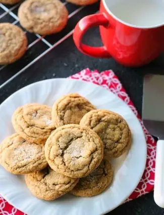 These Soft Baked Gingersnap Cookies are thick and chewy, and full of rich molasses, ginger, and spices for a wonderful Christmas cookie everyone will love!