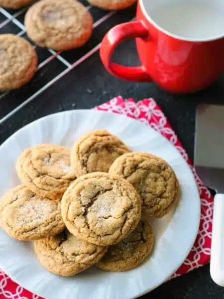 These Soft Baked Gingersnap Cookies are thick and chewy, and full of rich molasses, ginger, and spices for a wonderful Christmas cookie everyone will love!