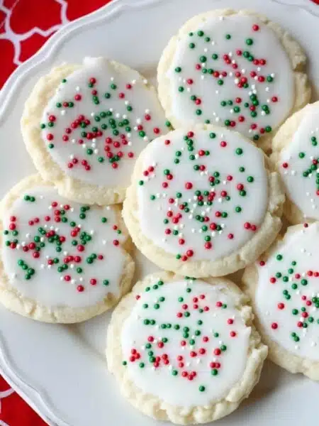 Meltaway cookies are a soft, lightly sweet shortbread cookie that literally melts away in your mouth. Top it with a thin glaze and red and green sprinkles for a festive Christmas cookie treat.