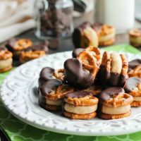 Peanut Butter Balls are made into pretzel bites for a salty-sweet addicting treat! Perfect for parties or Christmas neighbor gifts!