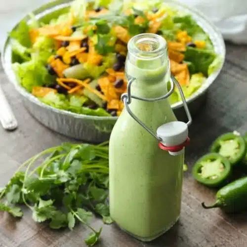 This Cafe Rio Style Cilantro Ranch Dressing is tangy, super creamy, and has a just the right kick of jalapeño. You'll want to put it on everything!