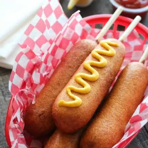 These homemade corn dogs are lightly sweet, crisp, and hand-dipped just like the ones at Corn Dog Castle in California Adventure, Disneyland. They freeze well too!