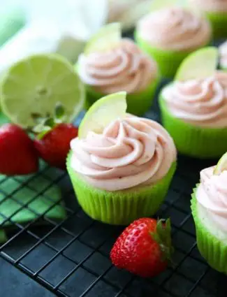 Strawberry Lime Cupcakes are perfect for summer, with a tangy lime cupcake base and sweet strawberry frosting they are sure to be loved by all. A family-friendly, non-alcoholic alternative to strawberry margarita cupcakes!