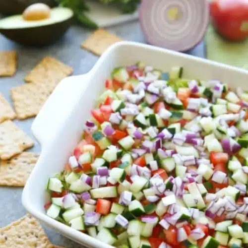 This Skinny Seven Layer Dip is loaded with fresh veggies, and makes a great appetizer or snack for any party or barbecue!