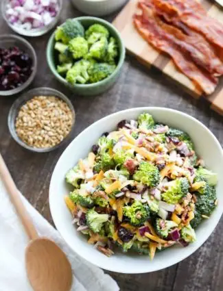 This Broccoli Salad recipe is our favorite! It's creamy, sweet, and salty, with the just the right amount of crunch. A great side dish for barbecues, potlucks, picnics or parties. Everyone loves this salad!