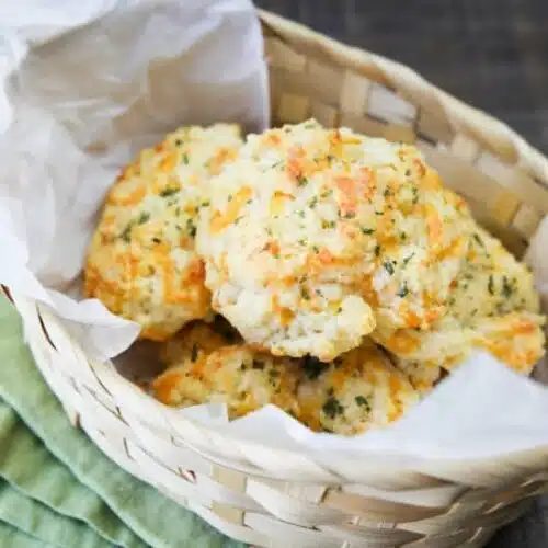 This copycat Red Lobster Cheddar Bay Biscuits recipe is super delicious! Crisp edges, a fluffy biscuit center, with plenty of cheese, garlic, and extra butter slathered on top. You won't be able to eat just one!