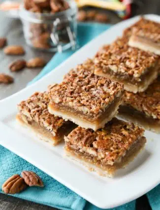 Pecan Pie Bars are made with an easy shortbread crust and delicious pecan pie filling. A crowd-pleasing Thanksgiving or Christmas dessert that will serve many guests.