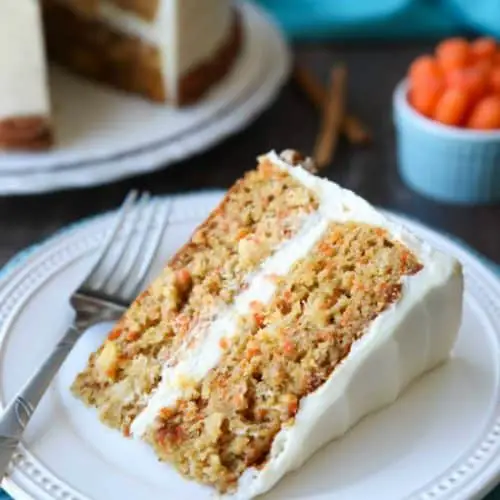 This easy carrot cake recipe is moist, perfectly-spiced, and topped with the BEST cream cheese frosting. Customize it with your favorite fillers or enjoy it simply as is.