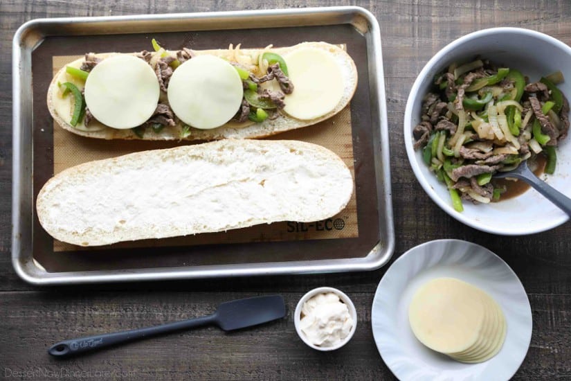 Philly Cheesesteak French Bread is a delicious open-faced sandwich with plenty of juicy meat, crisp veggies, and melty cheese for an easy dinner that is sure to satisfy!