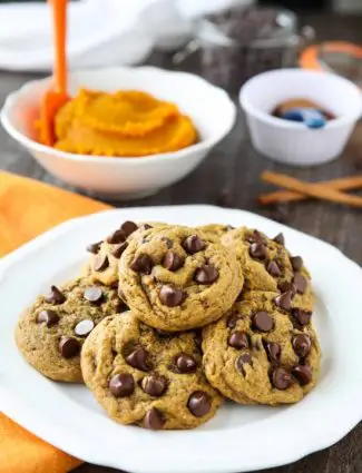 These soft-baked Pumpkin Chocolate Chip Cookies are a little chewy, a little cakey, and full of pumpkin spices and creamy chocolate chips. An easy and delicious fall treat!