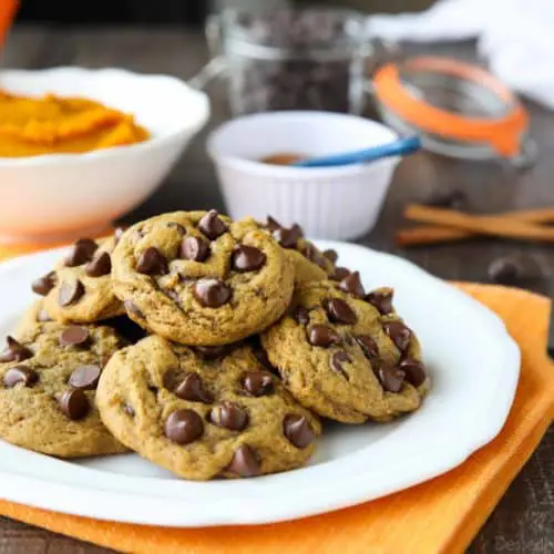 These soft-baked Pumpkin Chocolate Chip Cookies are a little chewy, a little cakey, and full of pumpkin spices and creamy chocolate chips. An easy and delicious fall treat!