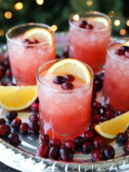 This non-alcoholic Cranberry Orange Mocktail is an easy and refreshing fruit punch drink for the holidays. It's fizzy, fruity, and only 3 ingredients!