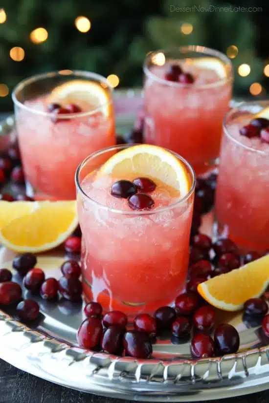 This non-alcoholic Cranberry Orange Mocktail is an easy and refreshing fruit punch drink for the holidays. It's fizzy, fruity, and only 3 ingredients!