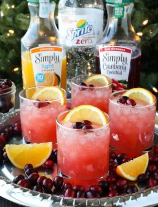 This non-alcoholic Cranberry Orange Mocktail is an easy and refreshing fruit punch drink for the holidays. It's fizzy, fruity, and only 3 ingredients!