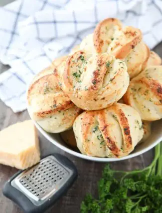 These easy Garlic Parmesan Rolls have layers of flavor to pull apart and savor in every bite. The perfect dinner rolls for holidays or any meal. You'll love these shortcut butterflake rolls. 