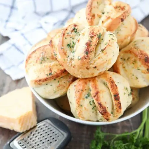 These easy Garlic Parmesan Rolls have layers of flavor to pull apart and savor in every bite. The perfect dinner rolls for holidays or any meal. You'll love these shortcut butterflake rolls. 