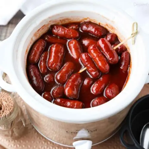 Crockpot Little Smokies is an easy appetizer for parties, the big game, or holidays. Only three ingredients and a slow cooker is all you need for these cocktail sausages. The sweet and tangy sauce is great on meatballs too! 