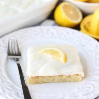 These Blonde Lemon Brownies are wonderfully tangy, sweet, and moist dessert bars. They have a dense texture like a fudgy brownie, and are topped with a creamy lemon icing for the ultimate lemon dessert.