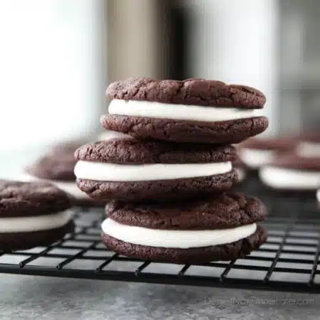 These easy Homemade Oreos are made completely from scratch. Soft, fudgy chocolate cookies are stuffed with a simple, vanilla cream filling. (Cream Cheese Frosting recipe also available for filling.)