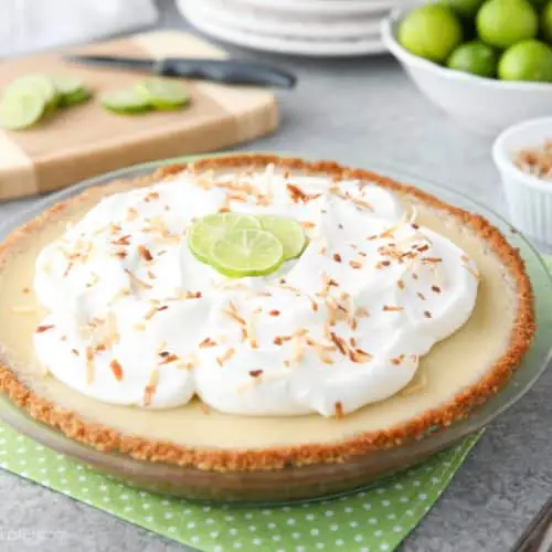 Coconut Key Lime Pie has coconut in the crust, cream of coconut in the key lime filling, and toasted coconut on top! A tropical dessert that's creamy, sweet, and tart.﻿