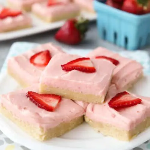 Strawberry Sugar Cookie Bars - soft, moist sugar cookie bars are topped with a natural strawberry frosting. Super easy to make and serves a crowd!