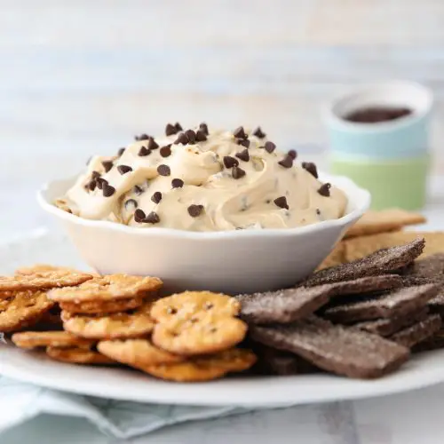 This buckeye dip recipe with cream cheese and mini chocolate chips is an easy, smooth, and creamy dip fashioned after buckeye peanut butter balls.