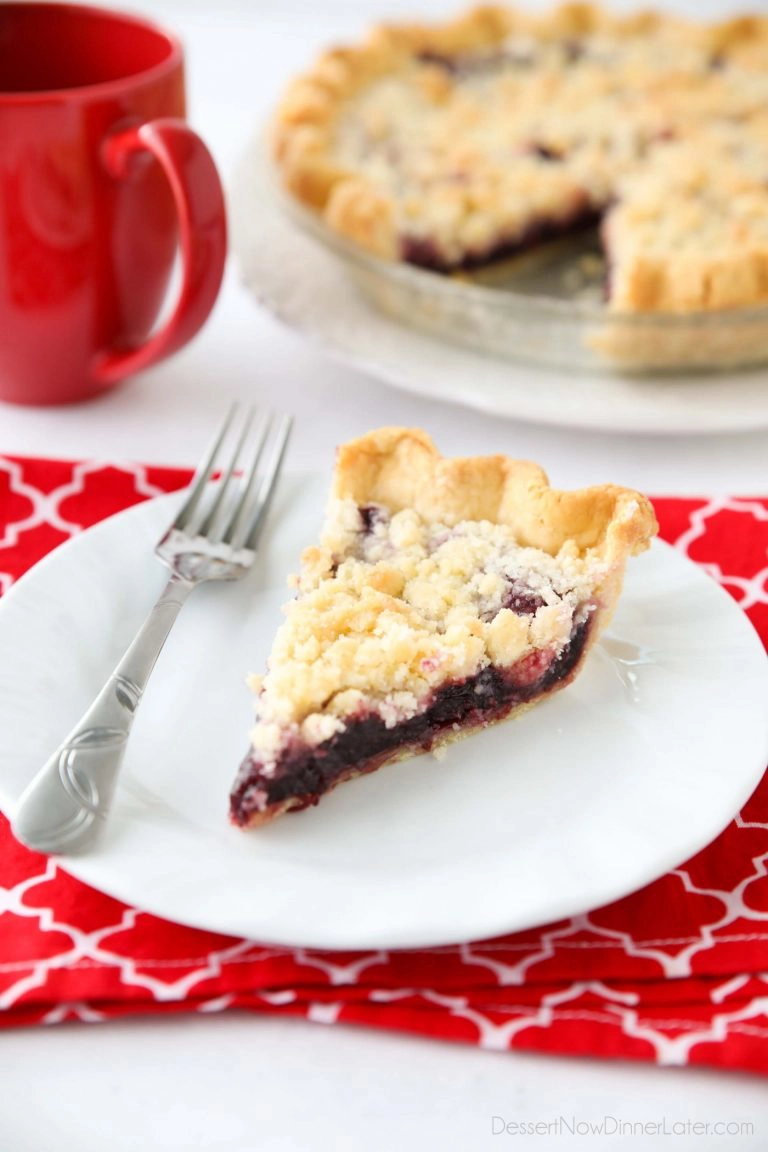 Cherry Crumb Pie can be made with fresh or frozen cherries, flavored with a hint of almond extract, and topped with a sweet crumble topping. Easy and delicious!