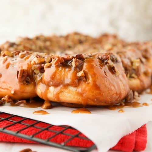 These easy caramel pecan rolls are so sticky, gooey, and delicious. They're made with frozen cinnamon rolls so half the work is done for you! Perfect for holidays or weekends.