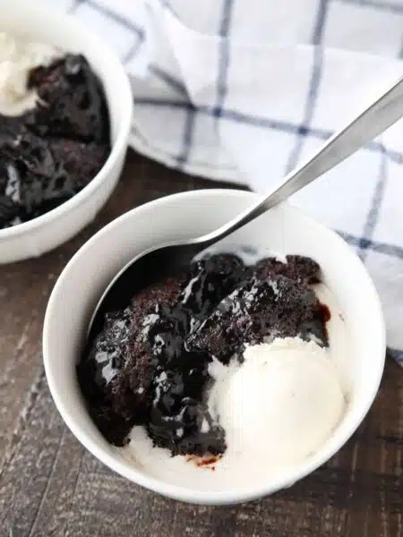 Hot Fudge Pudding Cake is easy to make and magically bakes chocolate cake with a hot fudge pudding sauce in the same pan. It's gooey, chocolatey, and delicious! Serve it warm with ice cream for an even tastier dessert!