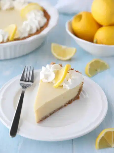 Lemon Cream Pie is tangy and sweet with a buttery graham cracker crust. It's just like key lime pie, but made with lemons, and topped with fresh sweetened whipped cream. A super easy spring or summer dessert, and great alternative to lemon meringue pie.