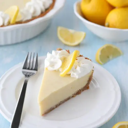 Lemon Cream Pie is tangy and sweet with a buttery graham cracker crust. It's just like key lime pie, but made with lemons, and topped with fresh sweetened whipped cream. A super easy spring or summer dessert, and great alternative to lemon meringue pie.