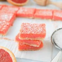 Grapefruit Bars are just like your favorite lemon bars with a shortbread crust and citrus curd, but with the sweeter flavor of pink grapefruit.